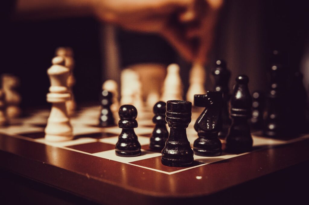 pexels-photo-1762815 Black and White Chess Pieces on Chess Board